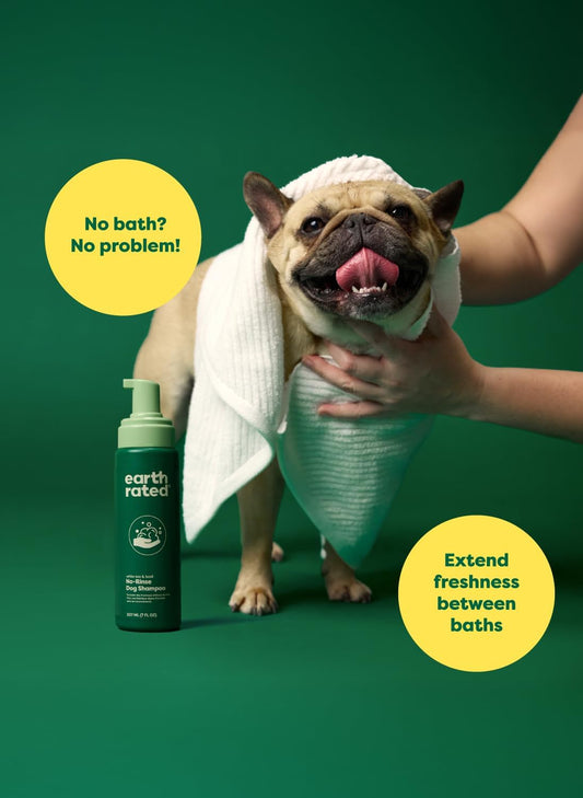 Earth Rated no-rinse dog shampoo in white tea and basil scent, 7oz bottle, suitable for quick, waterless pet cleaning.