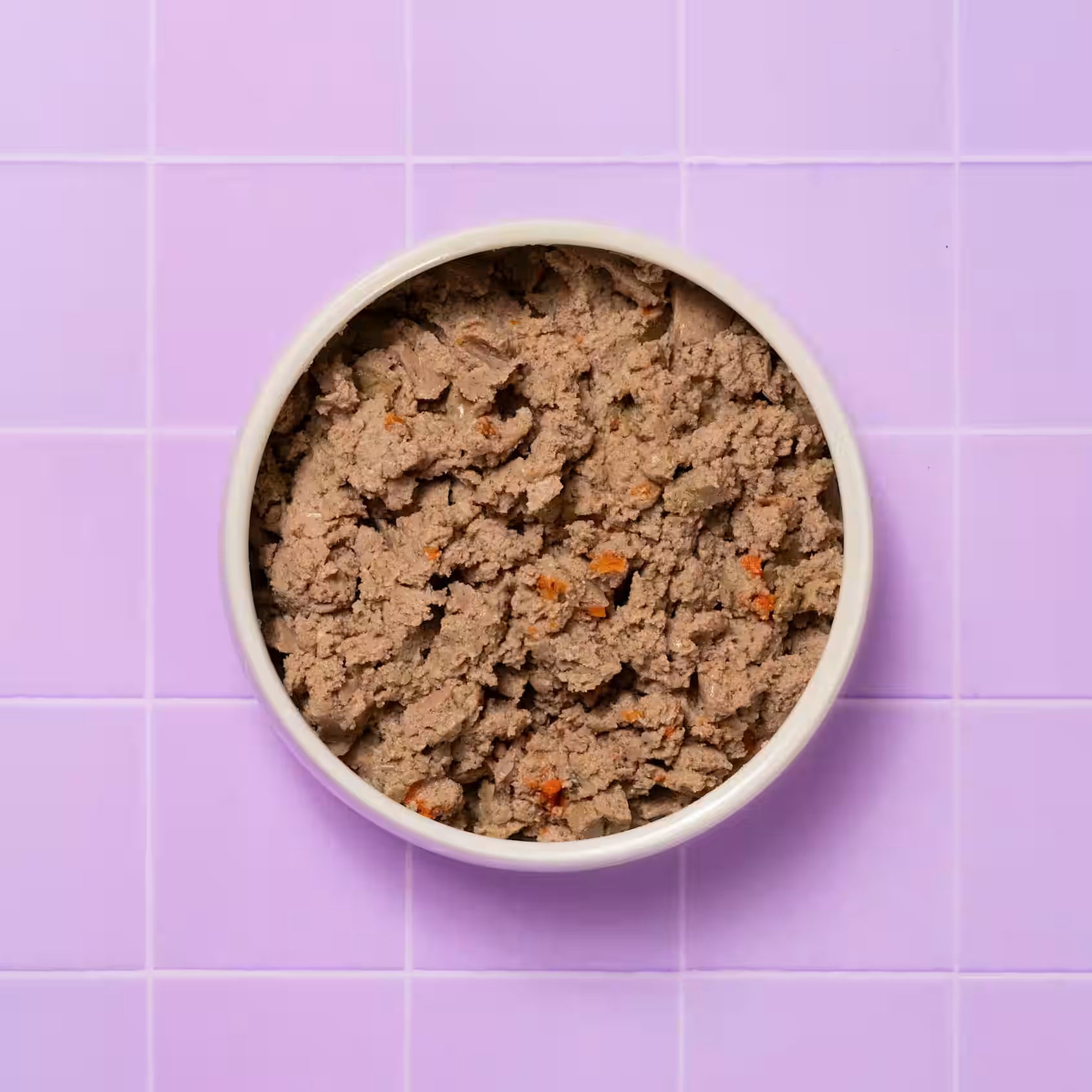 Full bowl of Pooch & Mutt Health & Digestion Complete wet dog food in a pet bowl, showcasing the nutritious dog food for healthy digestion.
