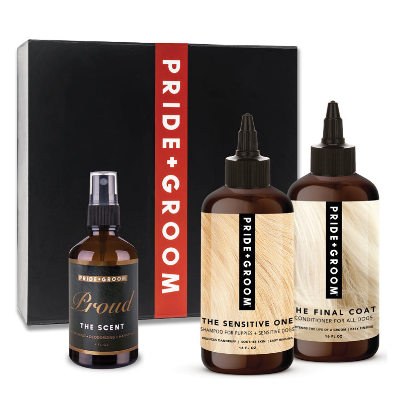 Premium dog grooming collection from Pride + Groom, featuring the Luxe Gift Set with grooming essentials in black packaging.