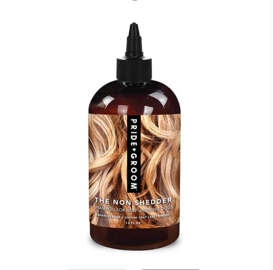 Pride + Groom The Non Shedder dog shampoo bottle for poodles, doodles, and curly coats, shown in a clear image.