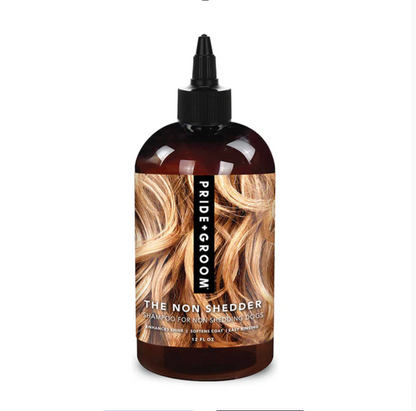 Pride + Groom The Non Shedder dog shampoo bottle for poodles, doodles, and curly coats, shown in a clear image.