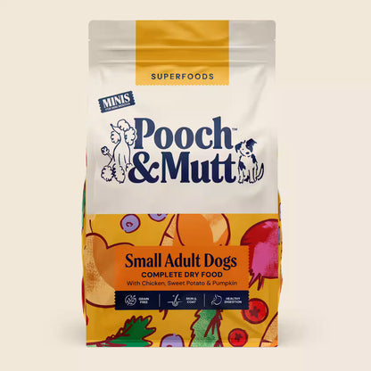 Small dog bowl of Pooch & Mutt Small Dog Complete Superfood dog food with colorful kibble and fresh ingredients.